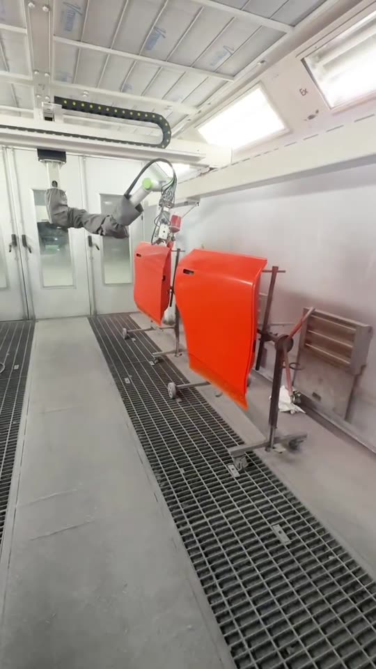 The NST robot spraying a red car door