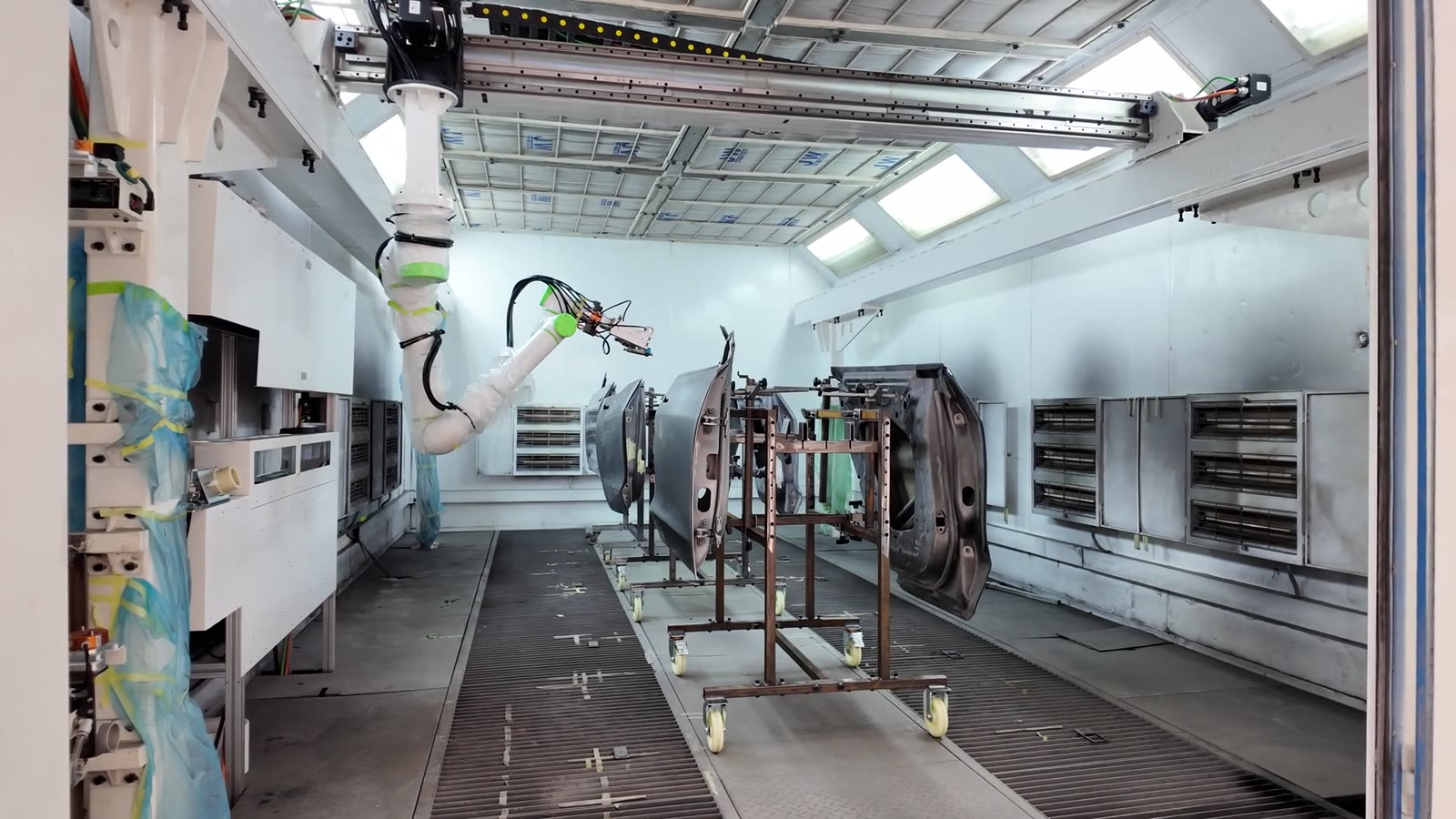 The NST gantry and painting robot at work in the spray booth