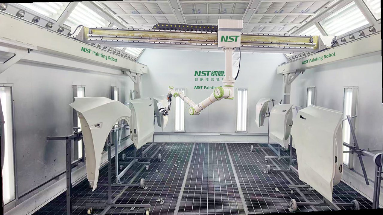 A batch of car parts being sprayed in one booth cycle by the NST robot